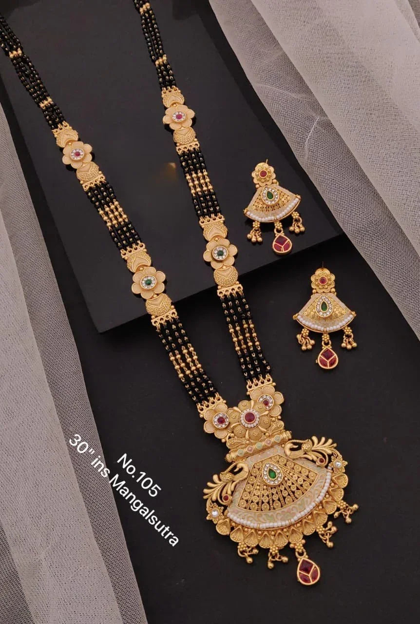 Traditional 30-inch gold Mangalsutra with black beads and matching gold earrings featuring red and green gemstones
