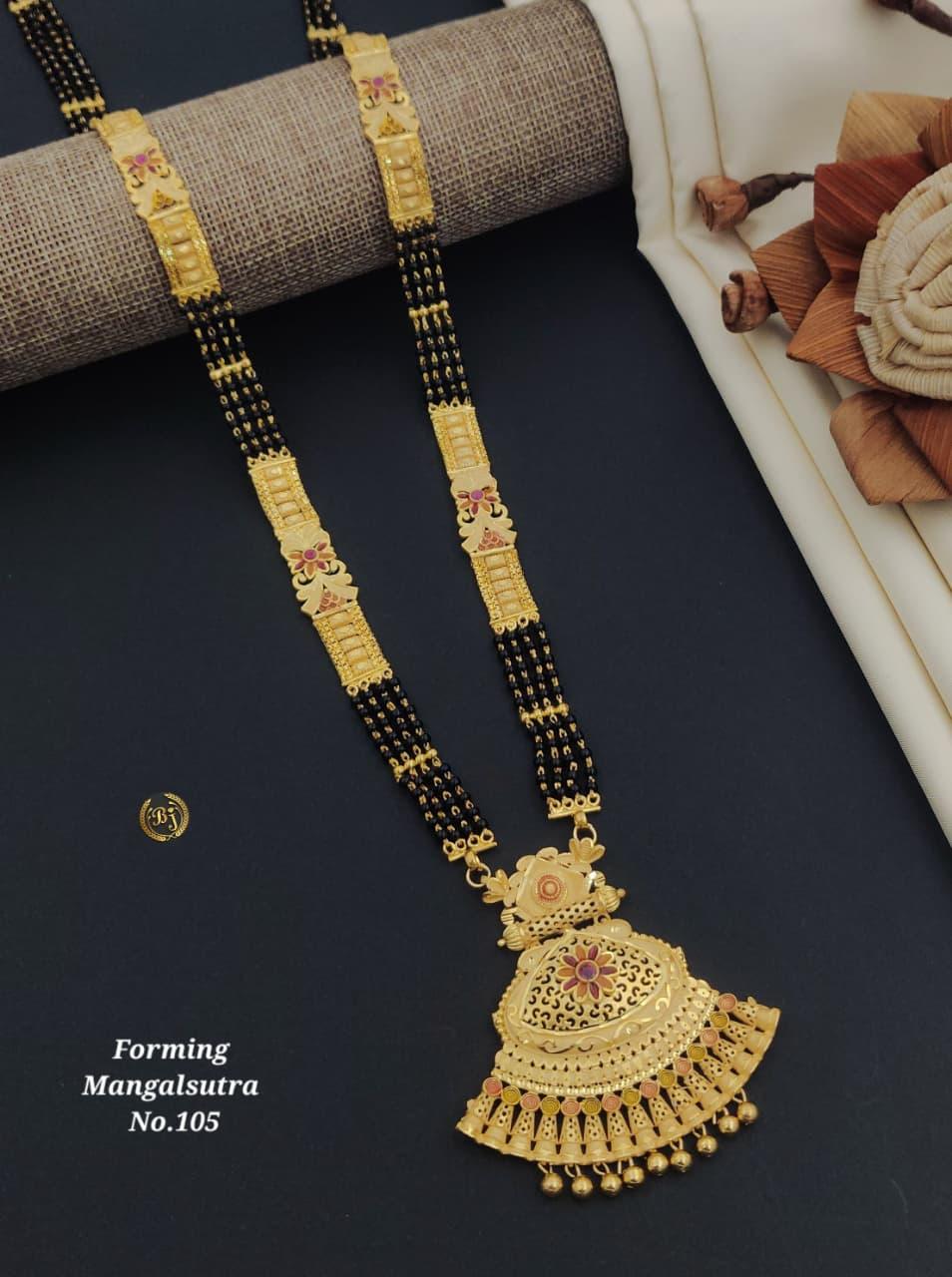 Traditional gold mangalsutra necklace with black beads and intricate floral pendant on black background