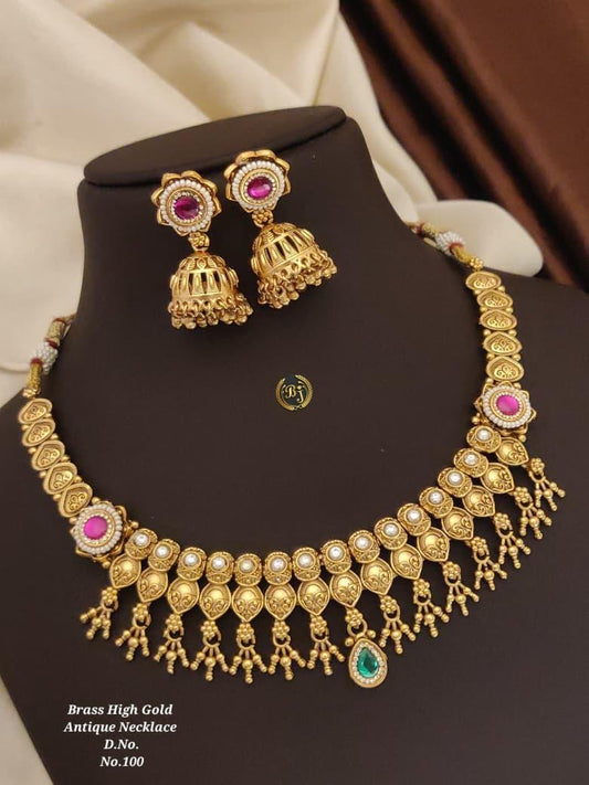 Brass high gold antique necklace set with pearl details, ruby and emerald stones, and matching jhumka earrings