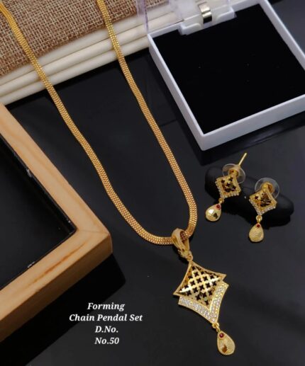 Gold forming chain pendant set with diamond accents and red gemstone drops displayed with earrings
