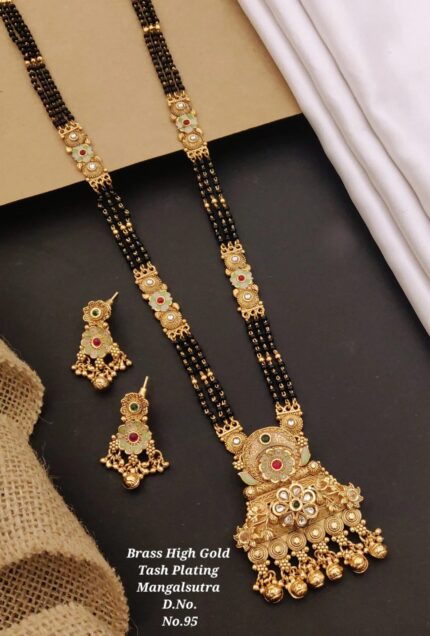 Brass high gold plating mangalsutra necklace with black beads and matching earrings on black surface